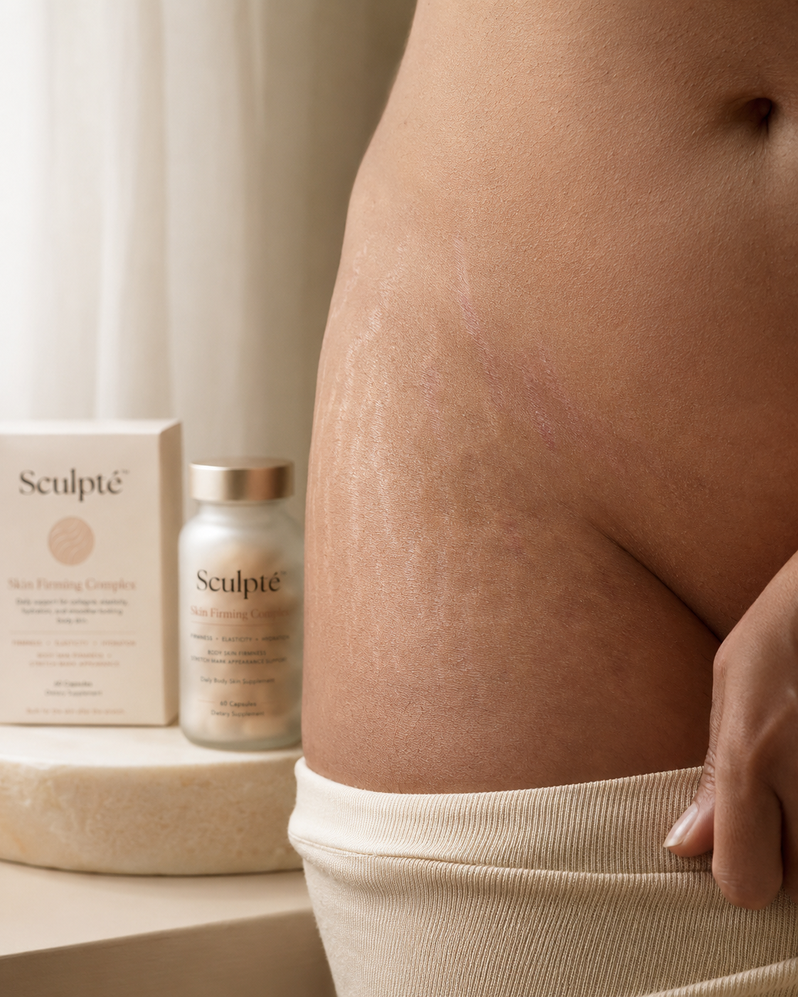 Close-up of stretch marks on body skin with Sculpt&eacute; Skin Firming Complex product in background
